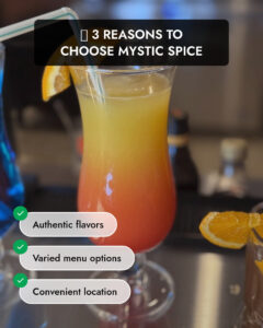 A vibrant cocktail with an orange slice garnish at Mystic Spice, promoting authentic flavors, varied menu options, and a convenient location in Charlotte.