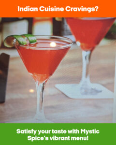 A vibrant image showing two cocktails garnished with a twist of green, set on a table, promoting Mystic Spice's menu.